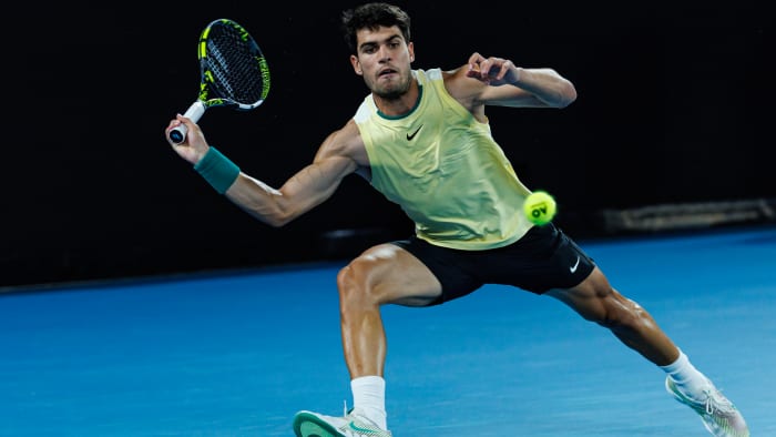 Carlos Alcaraz in action against Alexander Zverev at the Australian Open.